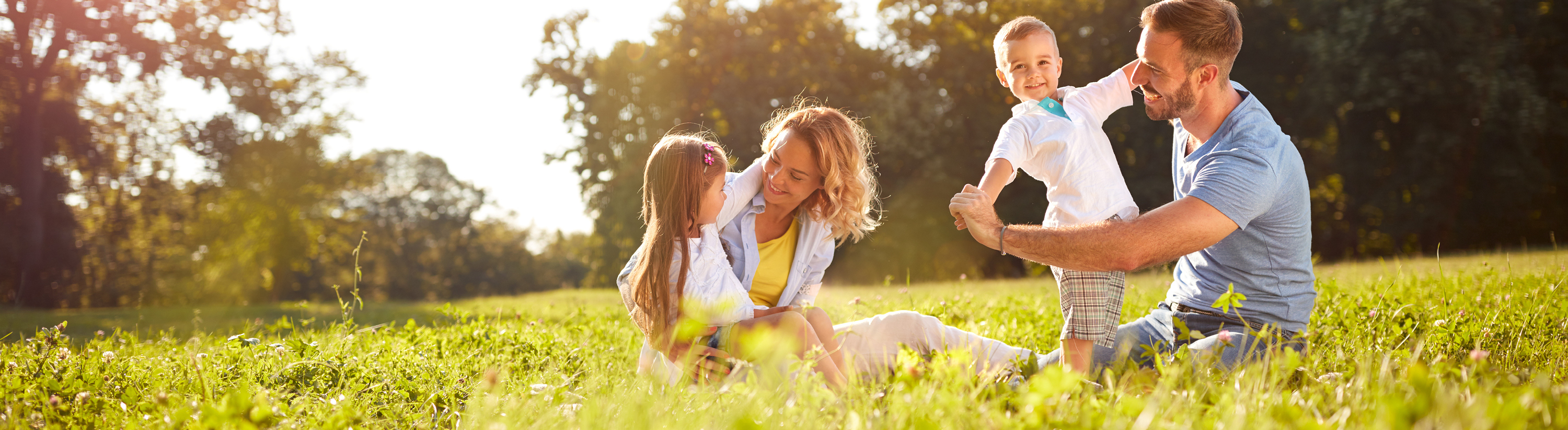Happy family playing outside in Marshall, TX